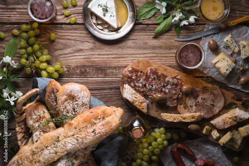 Assortment of appetizers on the wooden background horizontal