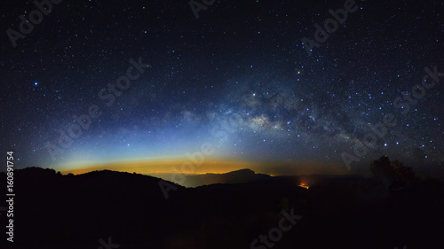 Panorama Milky Way Galaxy with light city at Doi inthanon Chiang mai, Thailand.Long exposure photograph.With grain