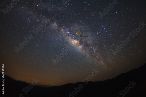 Milky way galaxy over moutain at Phu Hin Rong Kla National Park,Phitsanulok Thailand, Long exposure photograph.with grain