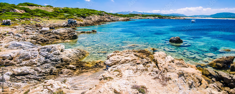 Beautiful costline with granite rocks and amazing azure water on Porto Pollo, Sardinia, Italy