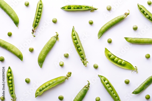 Peas pattern. Top view of fresh vegetable on a white background. Repetition concept