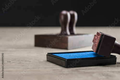 Close up shot of rubber stamps and ink box