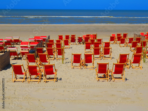 RED DECKCHAIRS ON THE BEACH OF THE TOUQUET , PAS DE CALAIS, HAUTS DE FRANCE , FRANCE 