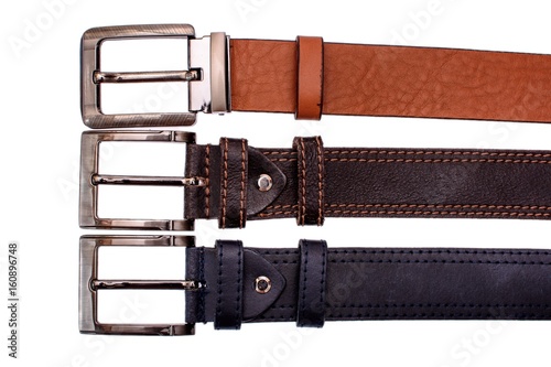 Several fashionable male belts red gray brown isolated on white background