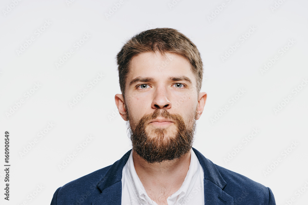 Businessman, businessman with a beard, businessman on a light background portrait Businessman, businessman with a beard, businessman on a light background portrait