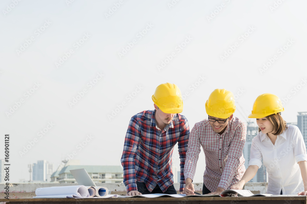 Asian professional engineer group and worker meeting, discussion, Brainstorm with construction blueprint on site workplace. Asian professional engineer group and worker meeting, discussion, Brainstorm with construction blueprint on site workplace.