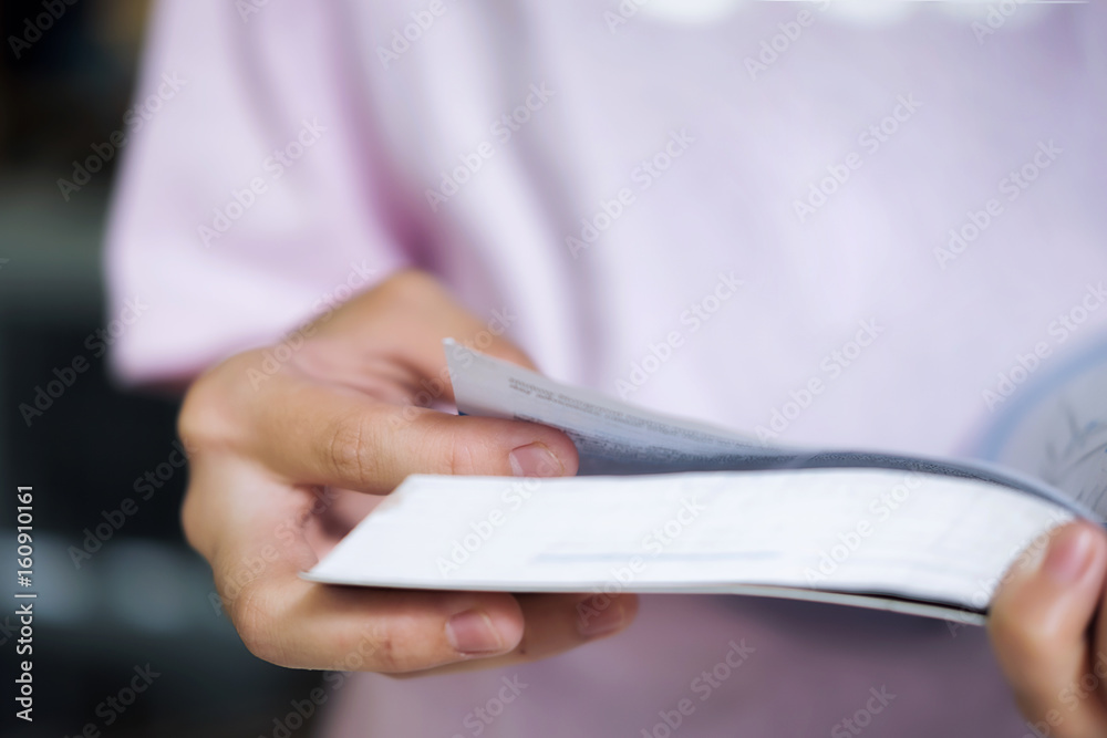 Education concept. Girl reading a book in library of school. Education concept. Girl reading a book in library of school.
