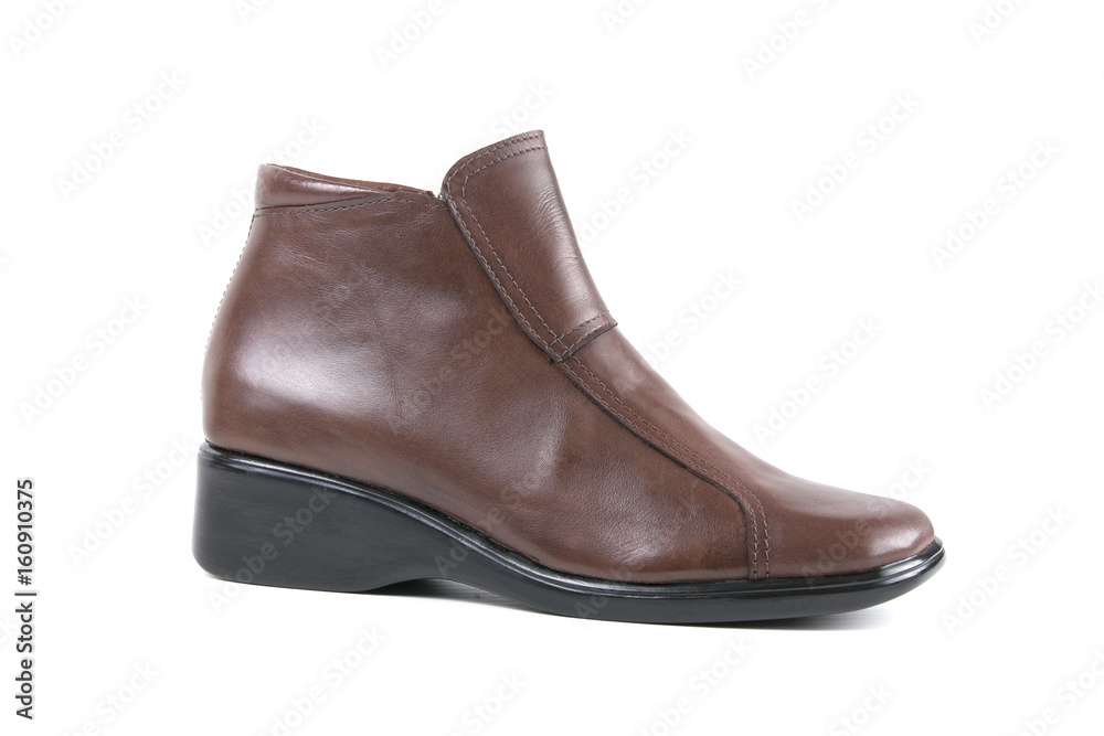 Female Brown Boot on White Background, Isolated Product, Top View, Studio. Female Brown Boot on White Background, Isolated Product, Top View, Studio.