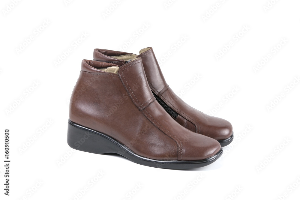 Female Brown Boot on White Background, Isolated Product, Top View, Studio. Female Brown Boot on White Background, Isolated Product, Top View, Studio.