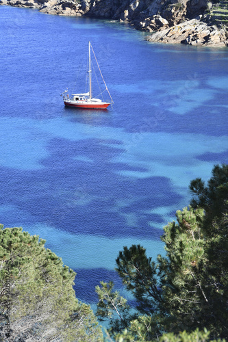 Sailboat in a Caribbean sea, cala delle Cannelle Giglio Island,Tuscany,Italy