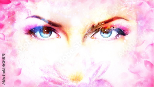 Woman eyes and lotus flower in cosmic background. Eye contact.