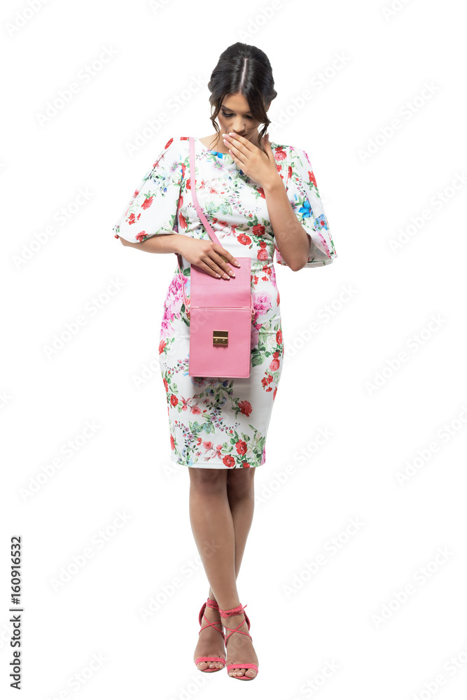 Surprised young elegant fashionable woman found something in her pink hand bag. Full body length portrait isolated on white background. Surprised young elegant fashionable woman found something in her pink hand bag. Full body length portrait isolated on white background.