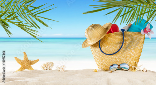Fototapeta Naklejka Na Ścianę i Meble -  Tropical beach with accessories on sand, summer holiday background.