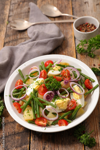 vegetable salad with potato,egg,bean and tomato