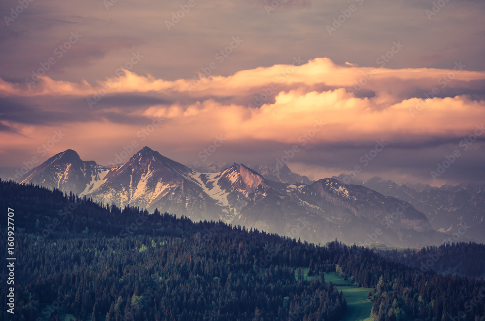 Obraz premium Beautiful spring panorama over Spisz highland to snowy Tatra mountains in the morning, Poland