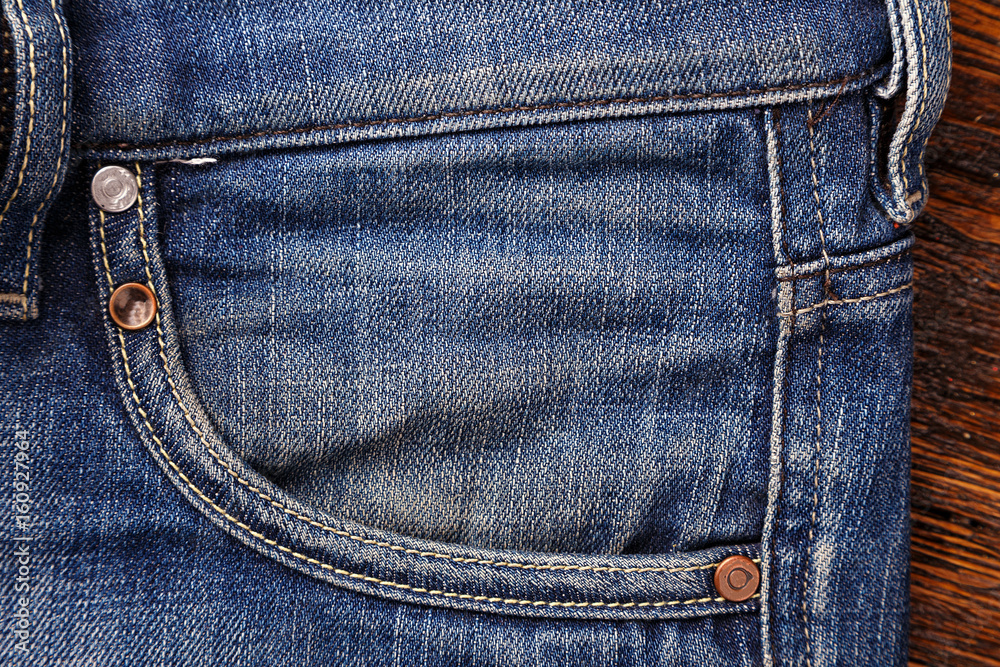 Jeans pockets. аbstract background of shabby and worn jeans Jeans pockets. аbstract background of shabby and worn jeans