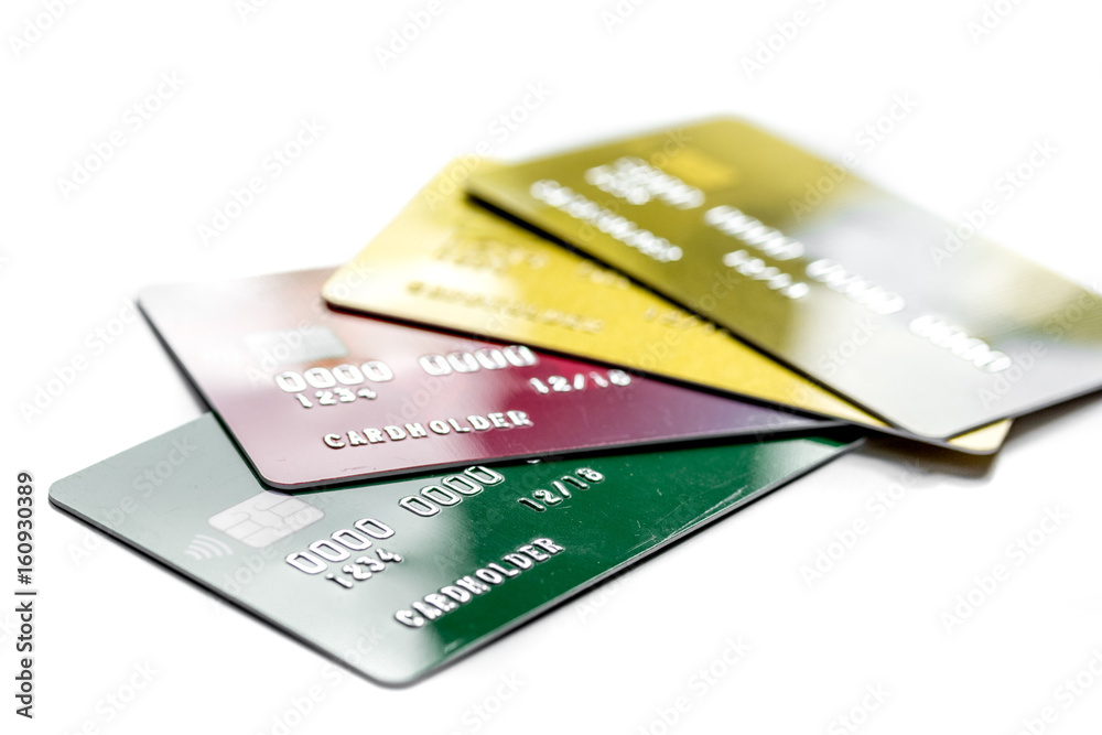 Payment composition with business credit cards at work place white background close up Payment composition with business credit cards at work place white background close up