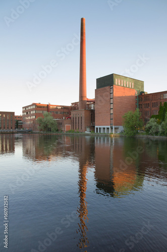 Tampere city old industrial buildings in Tammerkoski river, Finland.