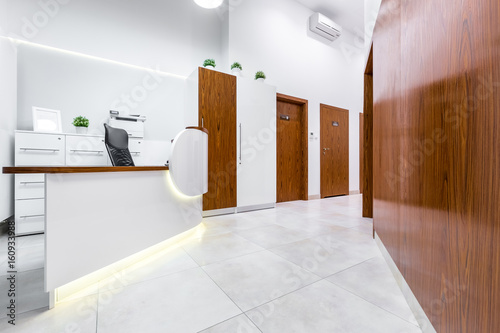 Reception of modern, private clinic photo