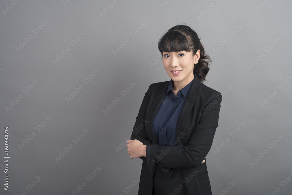 Beautiful Business Woman confident on grey background Beautiful Business Woman confident on grey background