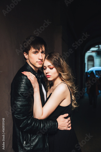 portrait of sexy couple . Beautiful couple touching at each other outdoor