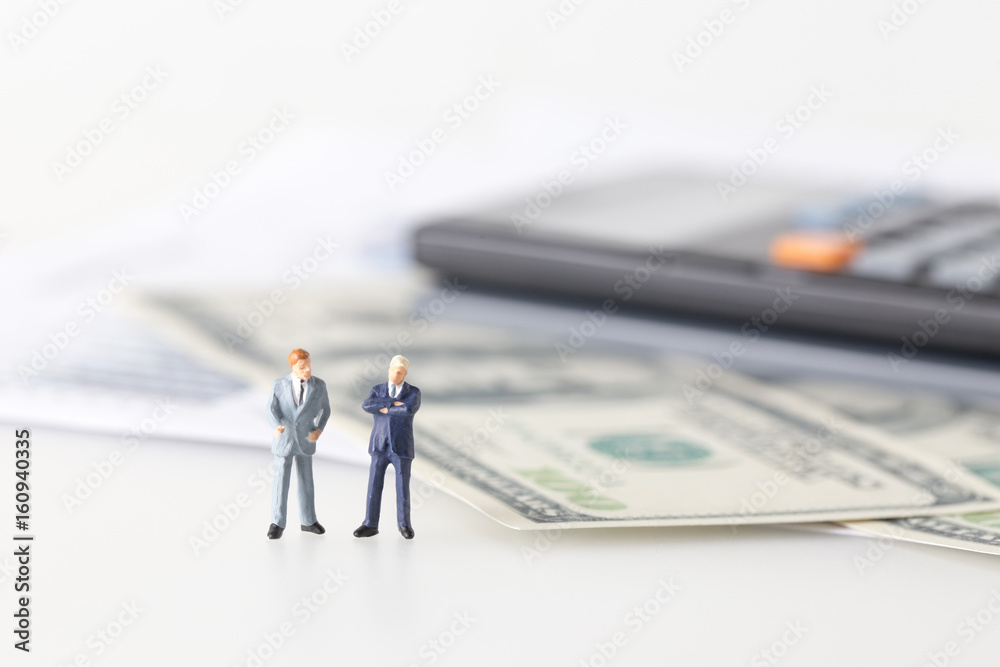 miniature model group of investor standing together isolated on white background. miniature model group of investor standing together isolated on white background.
