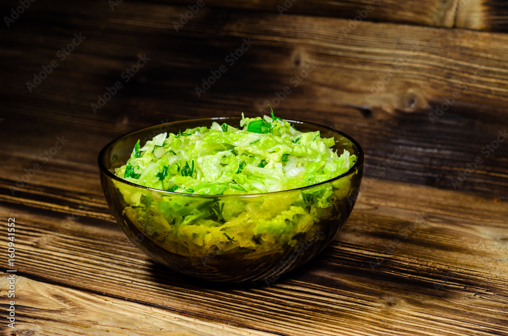 Salad with savoy cabbage and green onion in a bowl Salad with savoy cabbage and green onion in a bowl