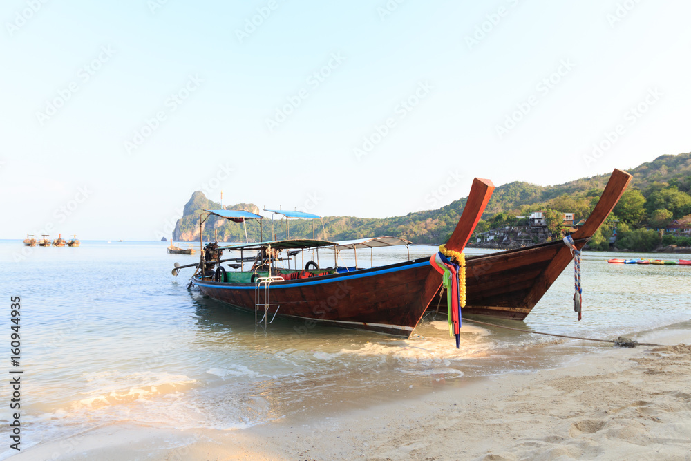 Long tail boats at beach at Koh Phi Phi, Thailand at sunrise