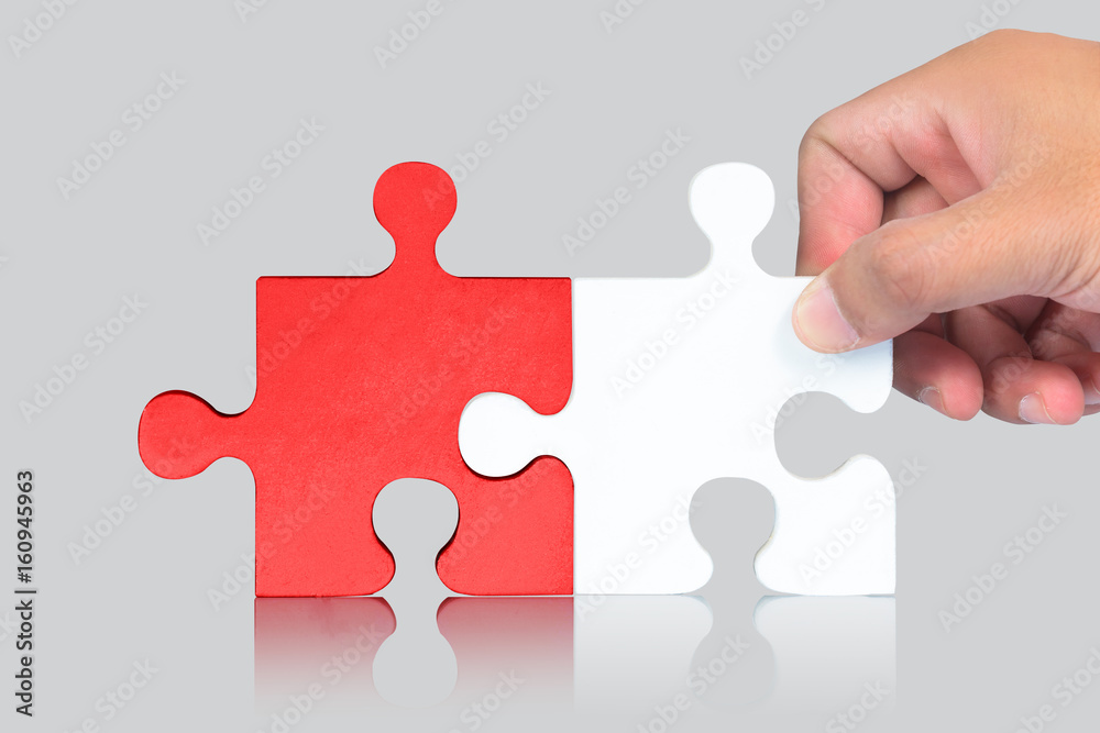 Hand and Puzzle pieces on white background Hand and Puzzle pieces on white background