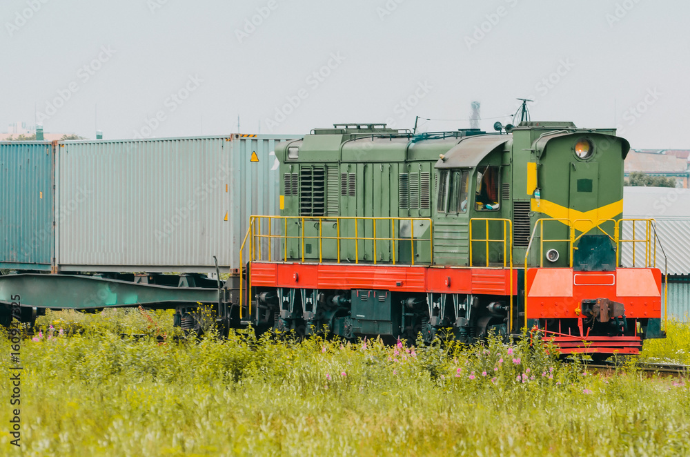 Freight train wagons with containers sorting station.