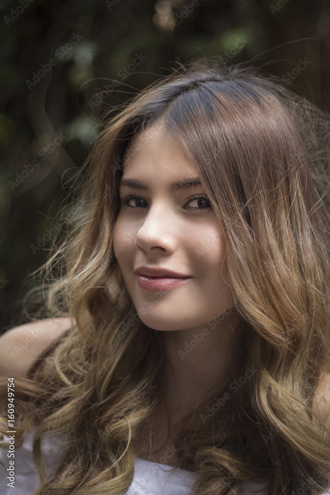 Portrait of a young woman with a beautiful smile Portrait of a young woman with a beautiful smile