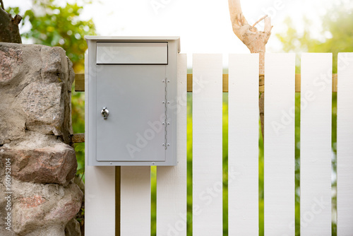 Post box on wooden fence. Sweden, Europe photo