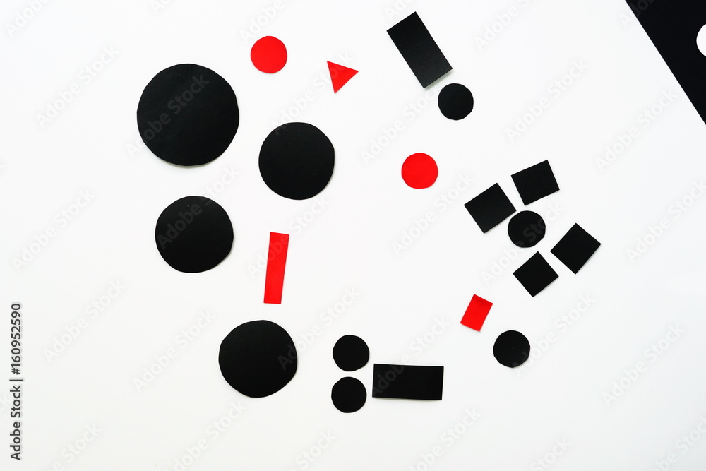 Abstraction of red and black cut paper on white background . top view. flat lay. copy space Abstraction of red and black cut paper on white background . top view. flat lay. copy space