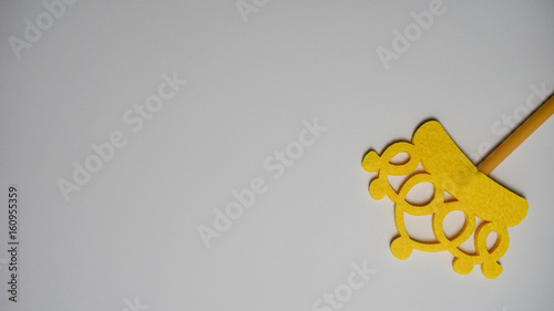 Top or flat lay view of Photo booth props yellow crown on a isolated white background flat lay. Birthday parties and weddings.