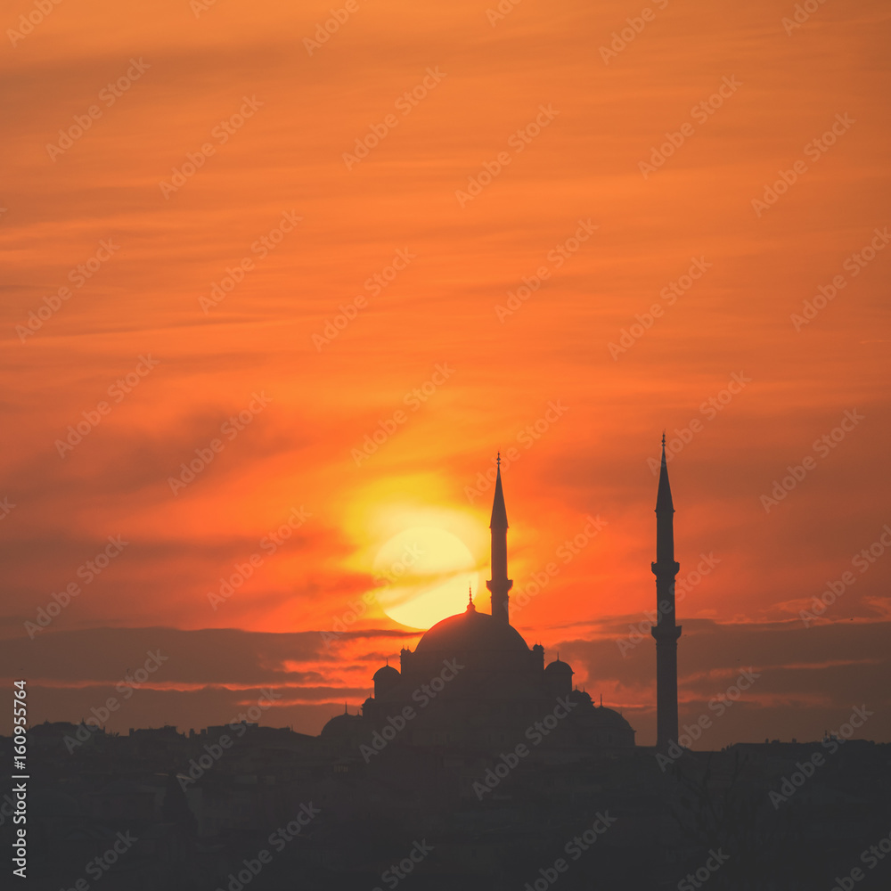 Mosque silhouette on The sunset and two minarets