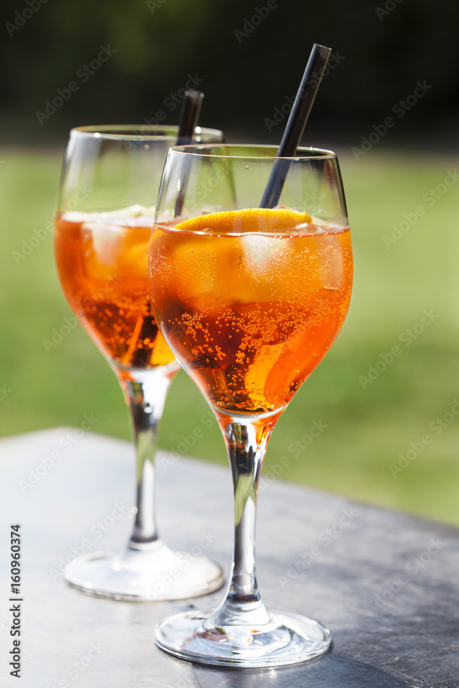 Apperol spritz cocktail in misted glass, selective focus Apperol spritz cocktail in misted glass, selective focus