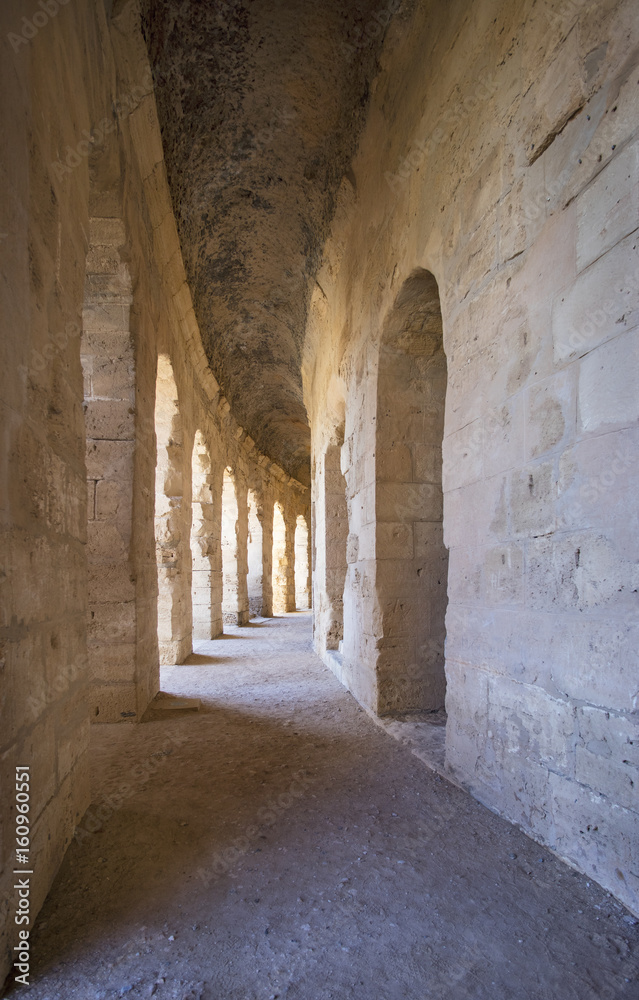 arches in hall of old amphitheater in Tunisia