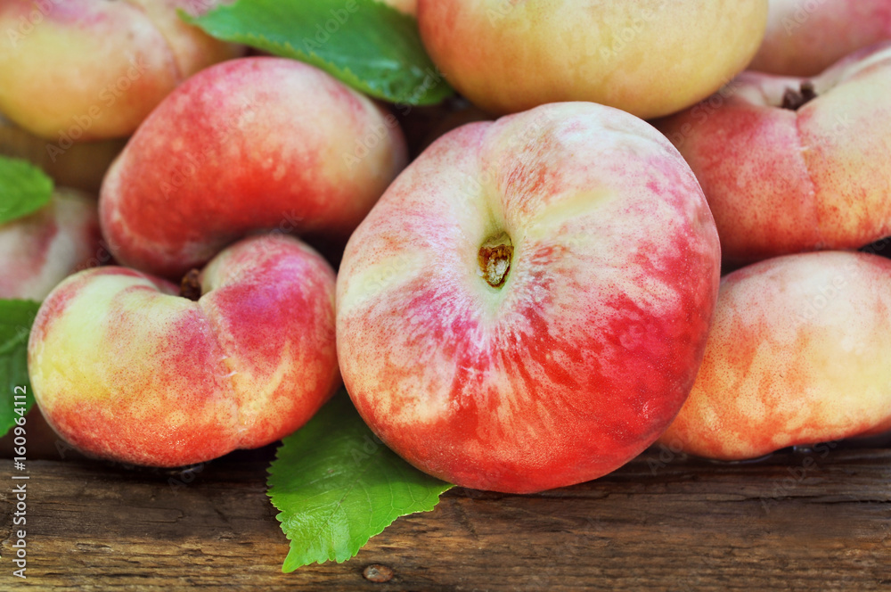 Crate of fresh ripe sweet peaches, selective focus