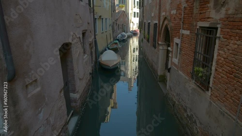 Romantic tour in gondola, rowed by a gondolier in the venice canal. photo