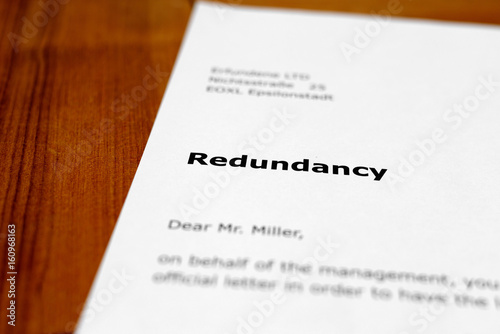 A letter on a wooden table - redundancy photo