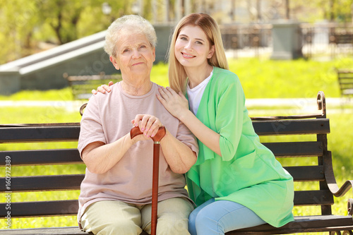 Elderly woman and young car...