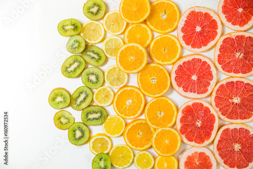Gradient color citrus slices on white background
