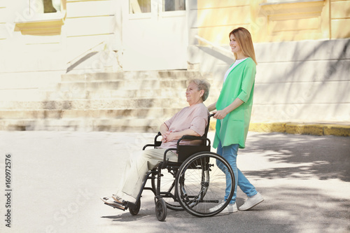 Disabled elderly woman and ...