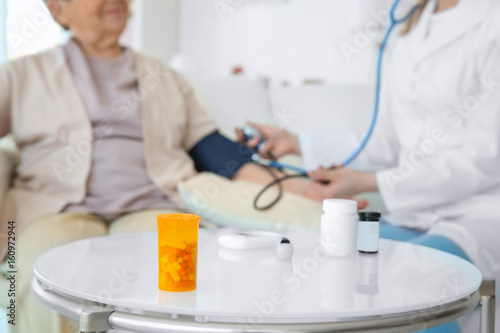 Table with medicines and bl...