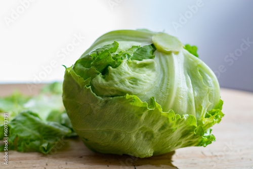 Iceberg lettuce, green vegetable from local market, farm fresh produce on wooden table