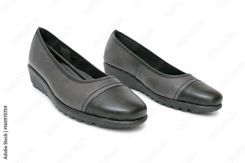 Female Black Shoe on White Background, Isolated Product, Top View, Studio. Female Black Shoe on White Background, Isolated Product, Top View, Studio.