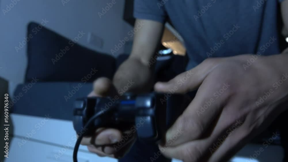 Young Man play with Videogames in Modern Apartment Young Man play with Videogames in Modern Apartment