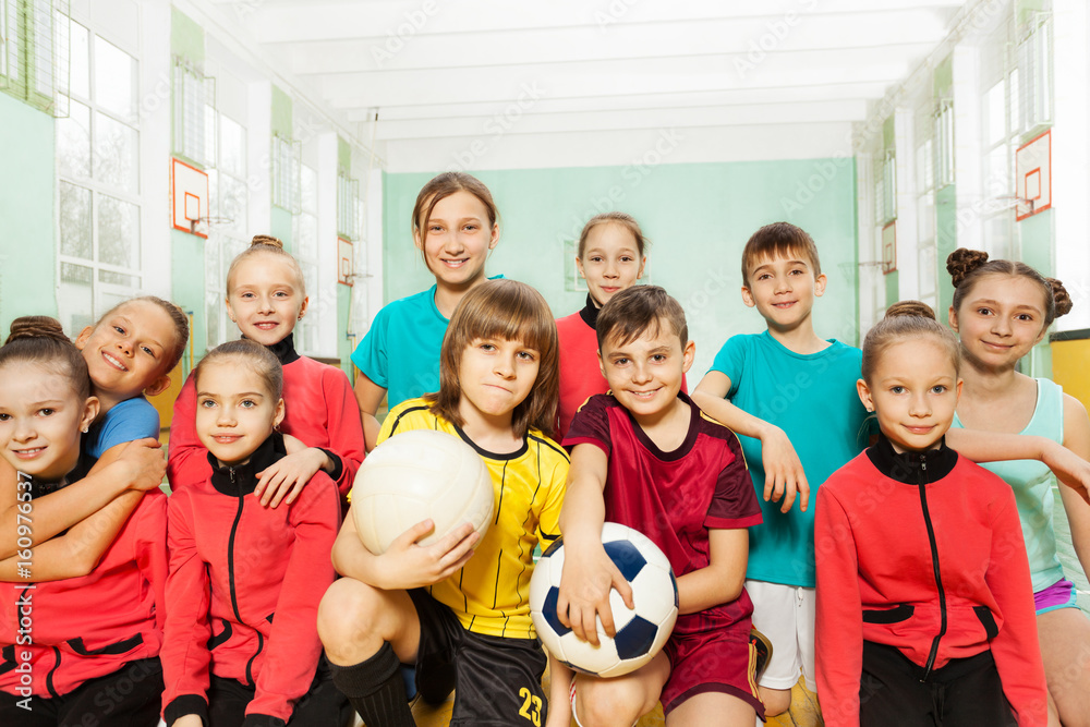 Children's soccer team in school sports hall