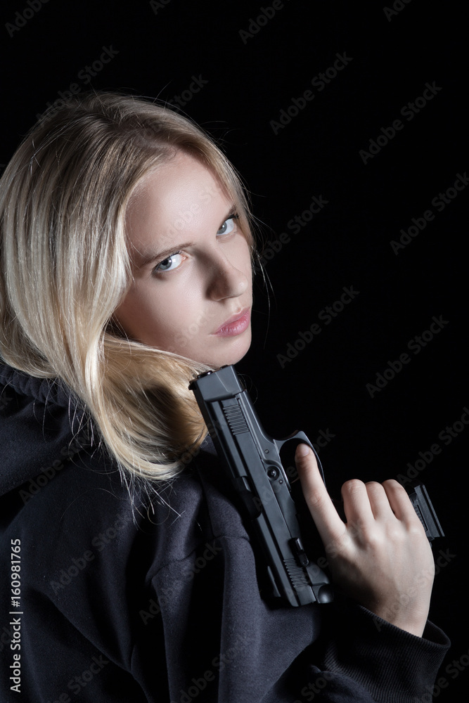 serious girl with gun on black background serious girl with gun on black background
