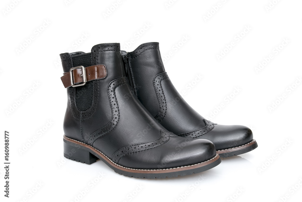 Female Black Boot on White Background, Isolated Product, Top View, Studio. Female Black Boot on White Background, Isolated Product, Top View, Studio.